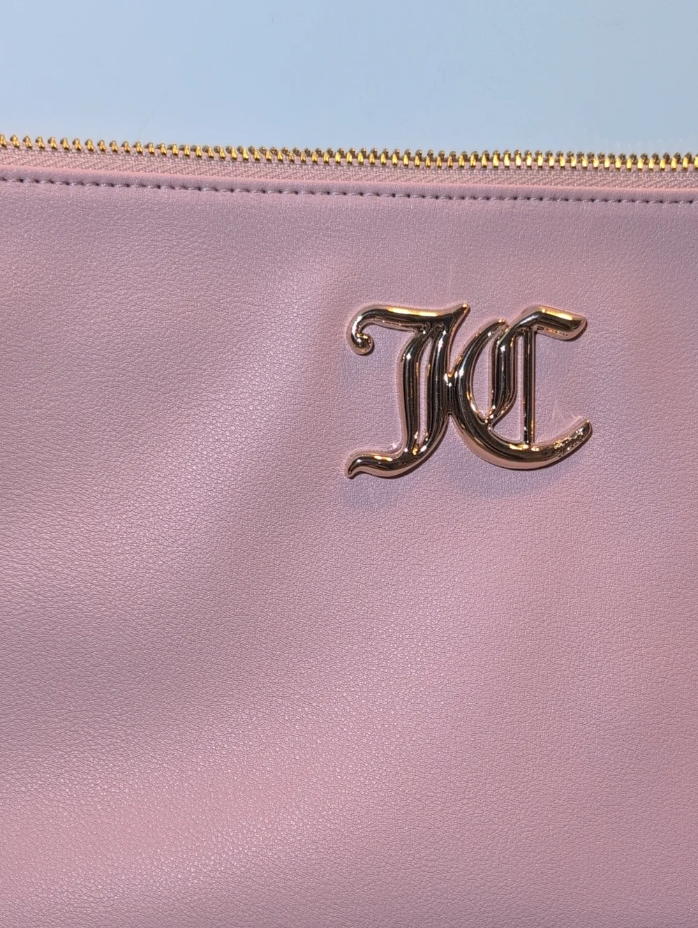 Juicy Couture Light Pink Vegan Leather Clutch Bag With Gold Hardware.